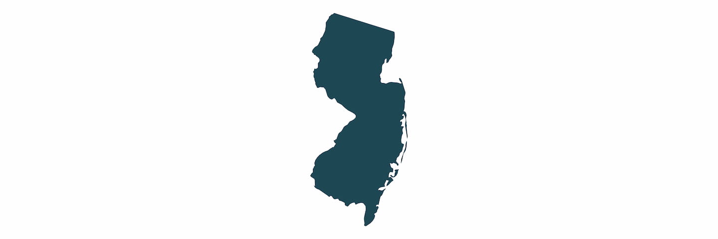 A simple dark blue silhouette map of the state of New Jersey on a white background.