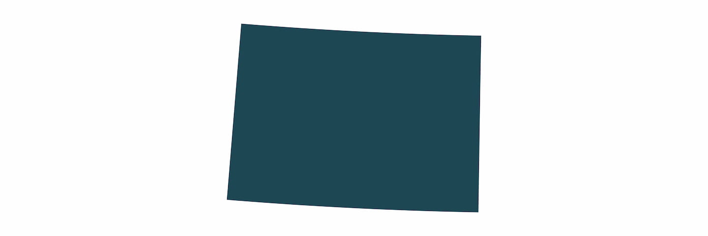 A simple, plain dark teal rectangle with a slight perspective distortion making it appear as a trapezoid, against a light gray background.