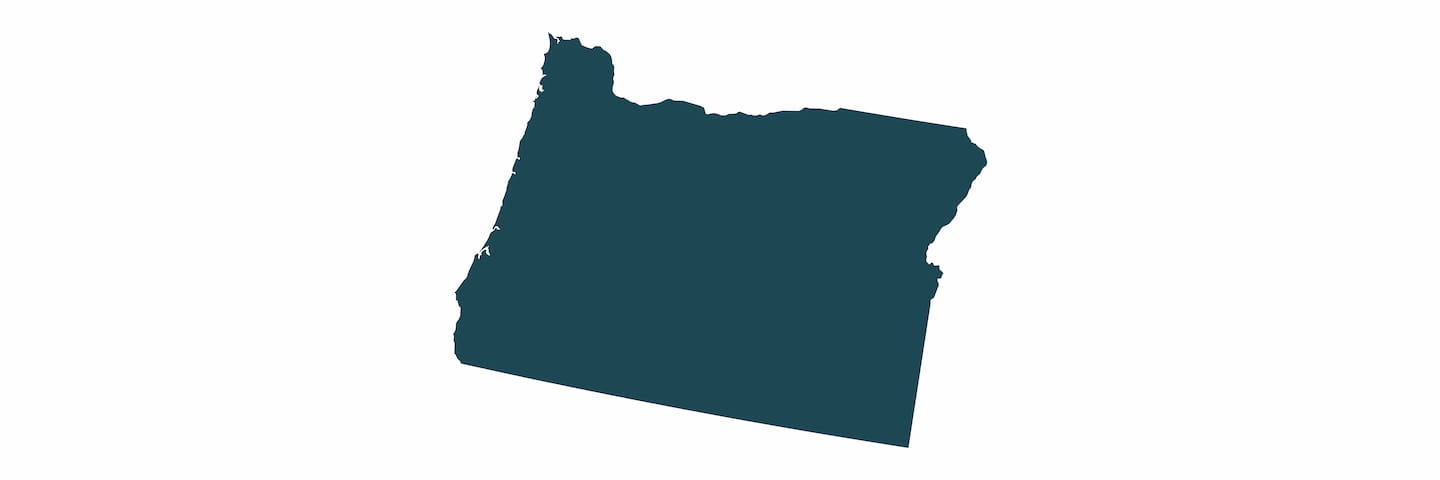 A simple, solid dark blue silhouette of the state of Oregon with no additional details or markings.